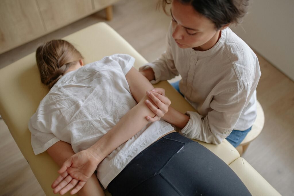 A woman receiving chiropractic treatment on a massage table for relaxation and health.